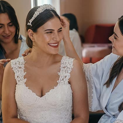 Bride wearing her wedding dress looking happy and vibrant